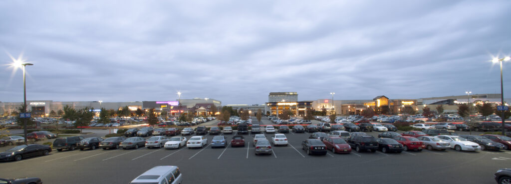 parking lot of a busy mall at night